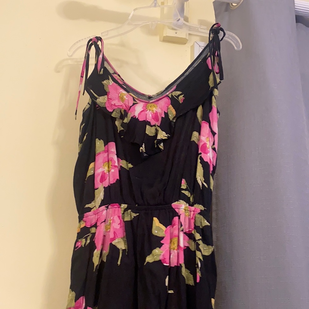 Black floral spaghetti strap dress. Style: high/ low and straps are adjustable